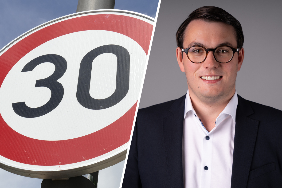 Maximilian Gludau, verkehrspolitischer Sprecher der FDP-Landtagsfraktion Sachsen-Anhalt neben einem Tempo-30-Schild.